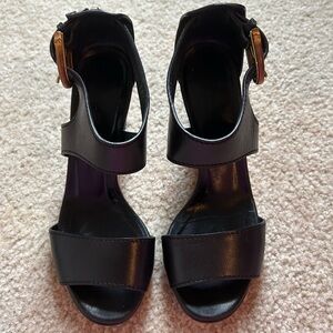 Gucci Black Leather Ankle-Strap Heeled Sandals with Gold Buckles